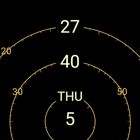 Vernier on a round Garmin display. Oversized brass wheels extend beyond the screen.